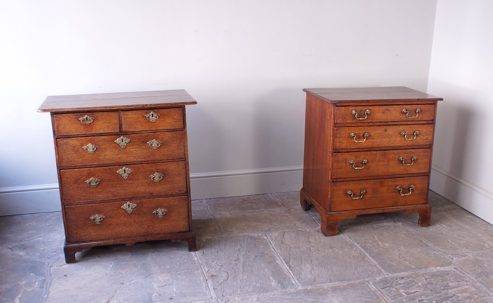 An early eighteenth-century oak chest of drawers featuring two short over three long drawers with brass drop handles and bracket feet. View VI