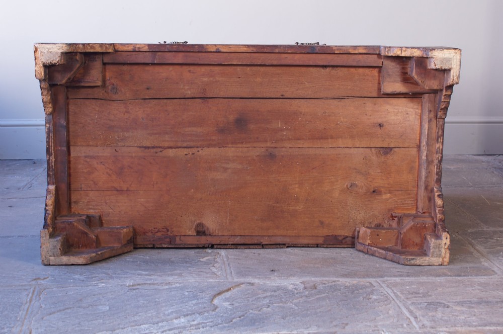 An 18th-century chest on chest crafted from figured ash featuring multiple graduated drawers with brass drop handles and bracket feet. View XIV