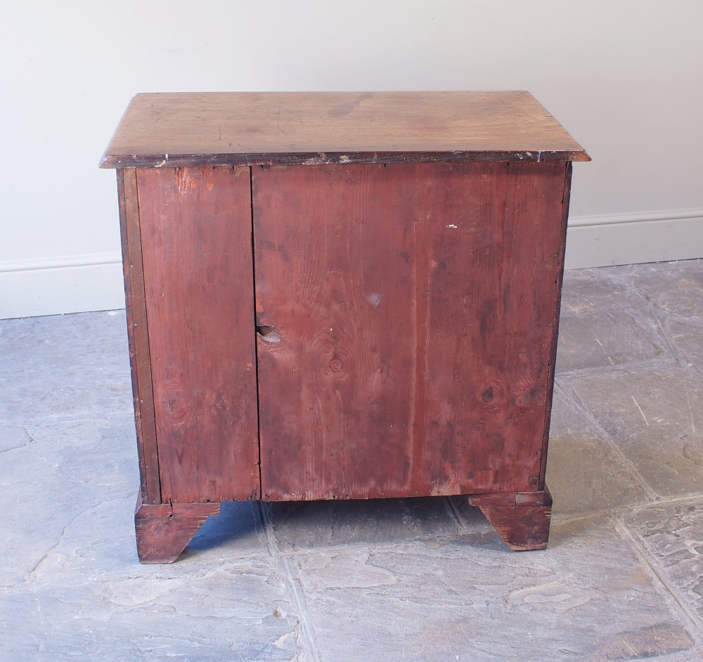 An 18th-century Georgian mahogany chest of drawers featuring four graduated drawers, brass swan-neck handles, keyhole escutcheons, and bracket feet. View VI