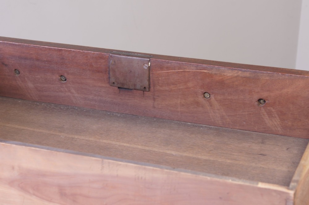 An 18th-century Georgian mahogany chest of drawers featuring four graduated drawers, brass swan-neck handles, keyhole escutcheons, and bracket feet. View VIII