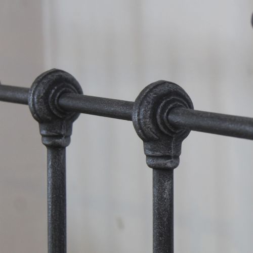 fig 1. A pair of single metal platform beds featuring dark charcoal vertical spindles and polished nickel top rails with spherical finials.