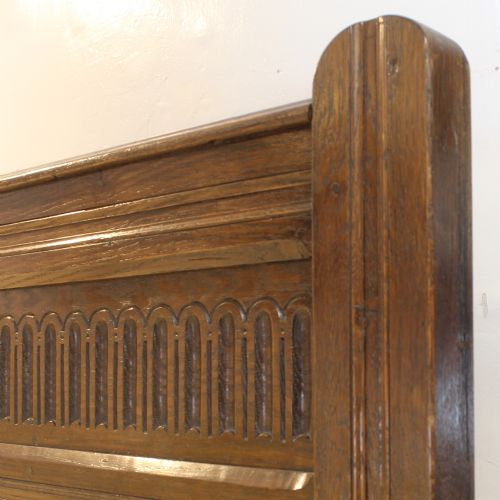 fig 1. A matching pair of dark oak single bed frames with panelled and carved headboards.