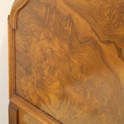 fig 2. A matching pair of Queen Anne style bed frames crafted from warm brown burr walnut with arched headboards and cabriole legs.