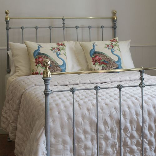 fig 1. A Victorian style metal double bed frame with vertical iron spindles, brass top rails, and brass finials.