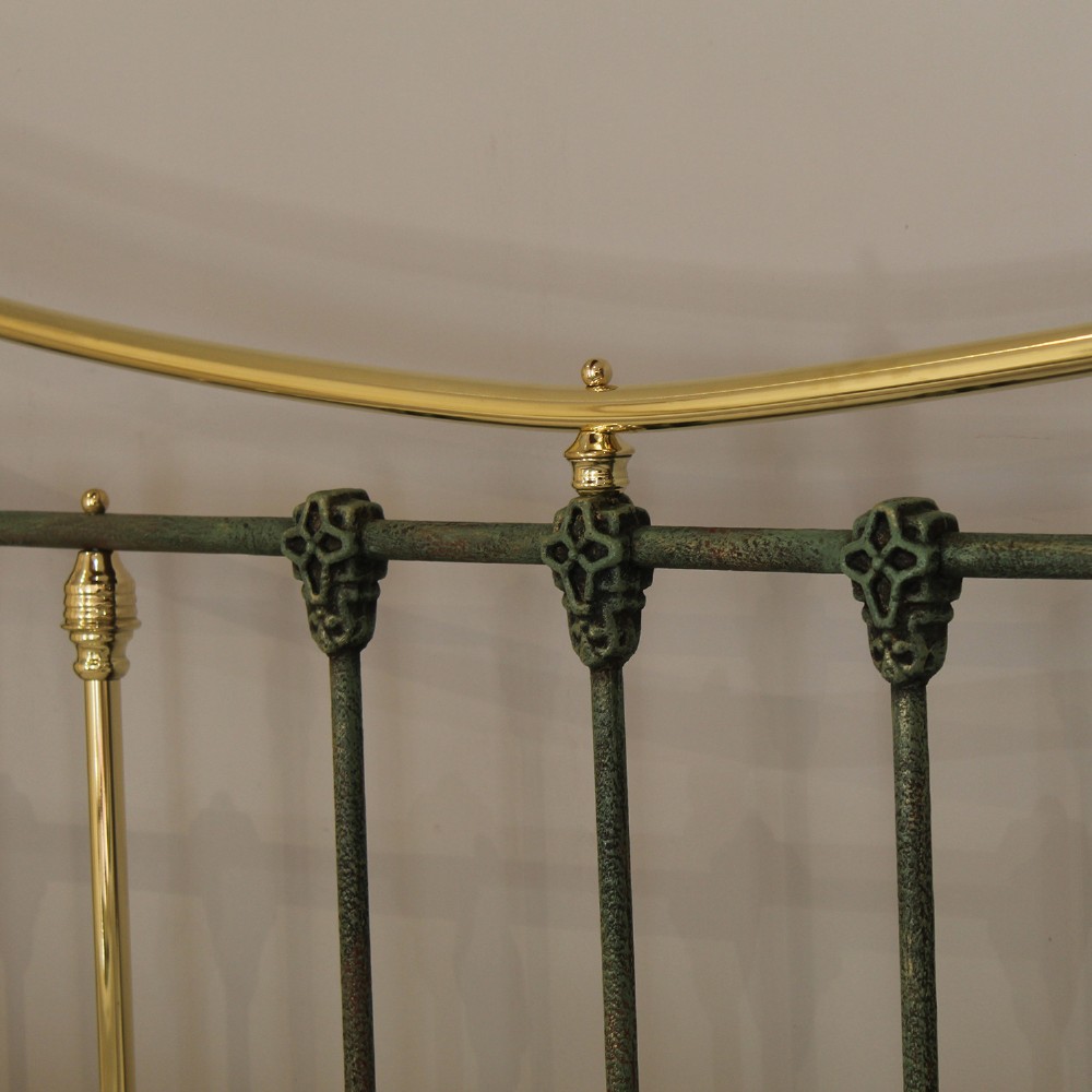A king-size green painted metal bedstead featuring curved brass top rails, polished brass finials, and vertical central spindles. View II