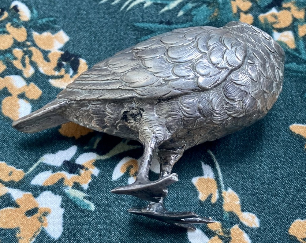 A Victorian sterling silver pepper pot finely cast in the shape of a snipe bird with detailed feathered texturing and a long beak. View V