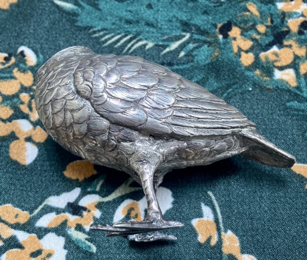 A Victorian sterling silver pepper pot finely cast in the shape of a snipe bird with detailed feathered texturing and a long beak. View VI