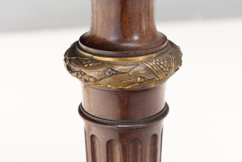 A mahogany kidney-shaped writing desk with a dark leather inset top, gilt-bronze mounts, four side drawers, and fluted legs joined by a curved stretcher. View IX