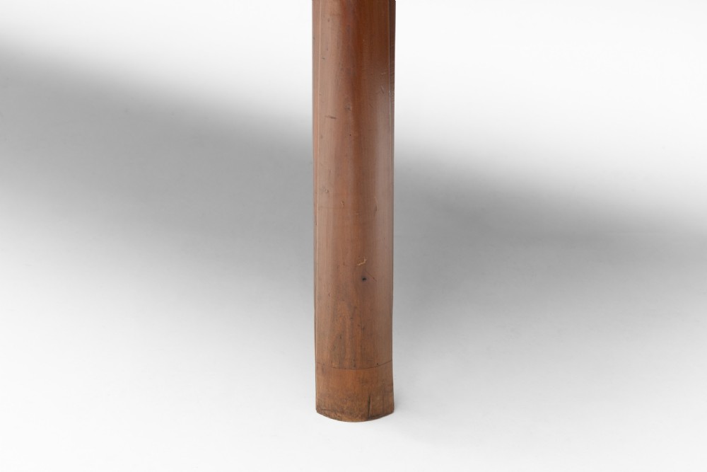A long rectangular antique cherry wood farm table featuring straight legs and a smooth polished finish. View VII