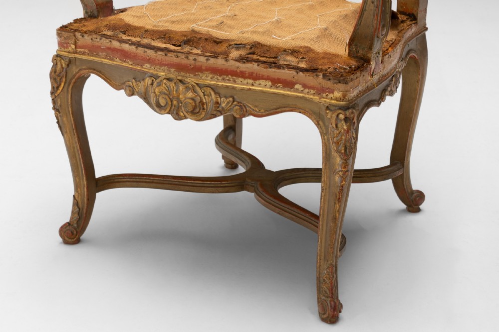 A set of six French gilded dining chairs featuring carved wooden frames, high backrests, and curved cabriole legs. View VI