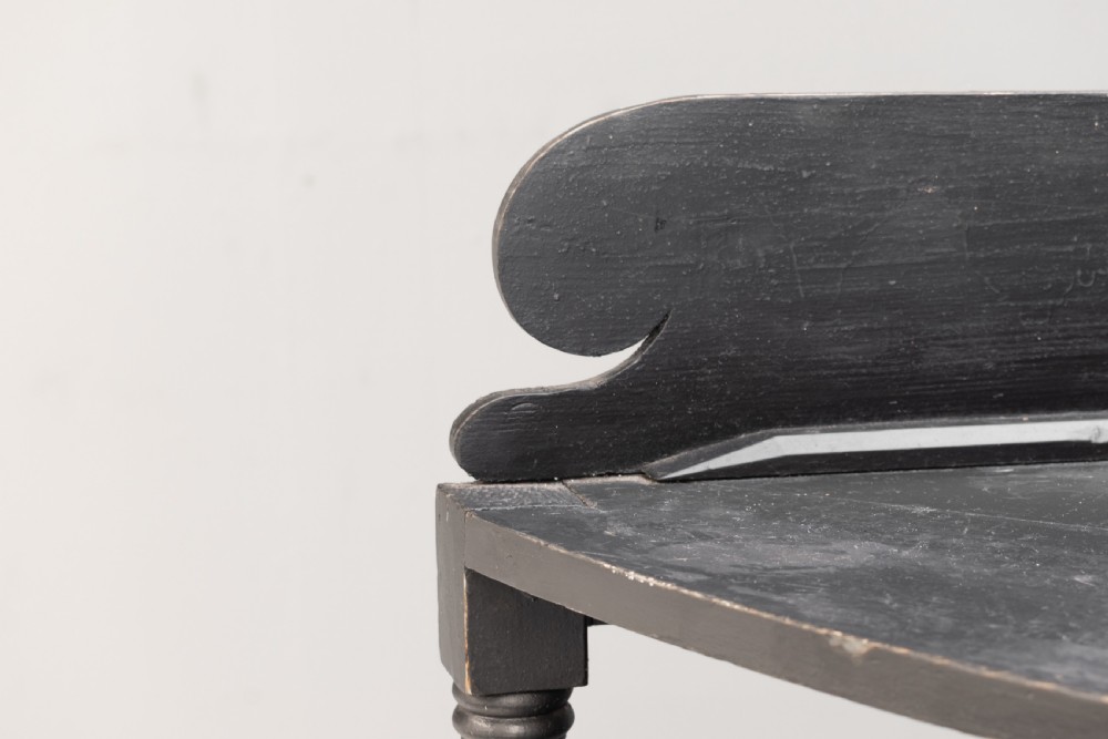 A tall 19th-century ebonised wooden corner shelf unit featuring six tiered triangular shelves and turned spindle supports. View V