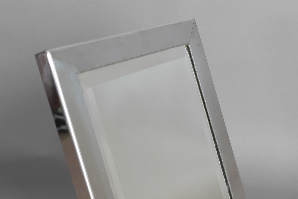 A rectangular silver-plated vanity mirror featuring a bevelled glass edge and an easel back support. View II