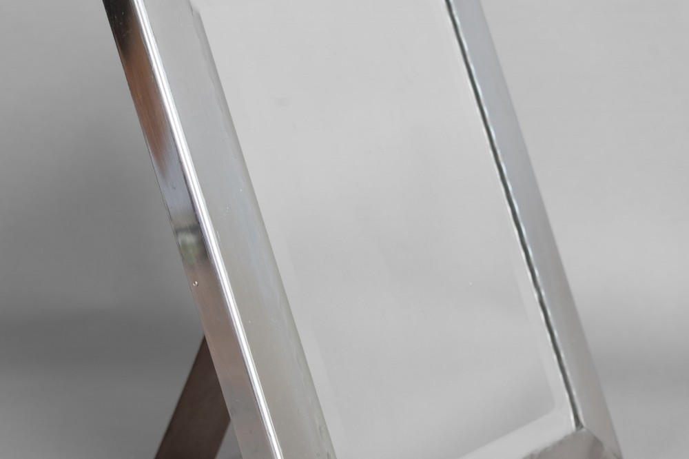 A rectangular silver-plated vanity mirror featuring a bevelled glass edge and an easel back support. View IV