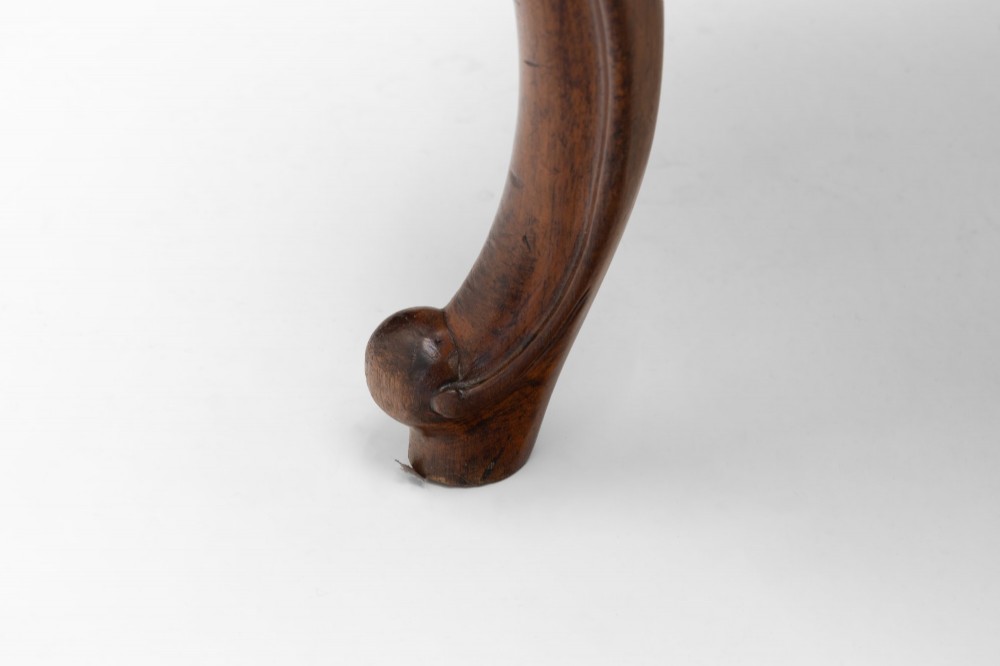 A pair of antique Victorian Rococo Revival carved timber side chairs with balloon backs, open scrollwork splats, cabriole legs, and neutral upholstery. View VII