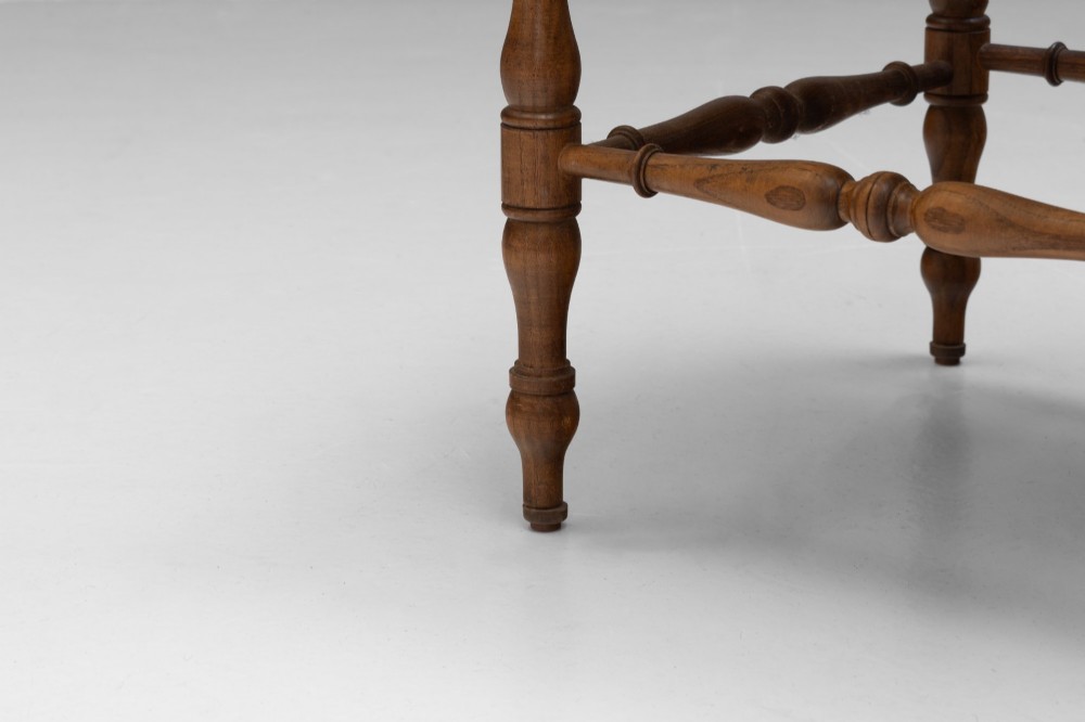 A pair of matching wooden corner chairs featuring turned bobbin spindles, raised armrests, turned leg stretchers, and square hand-woven rush seats. View VI