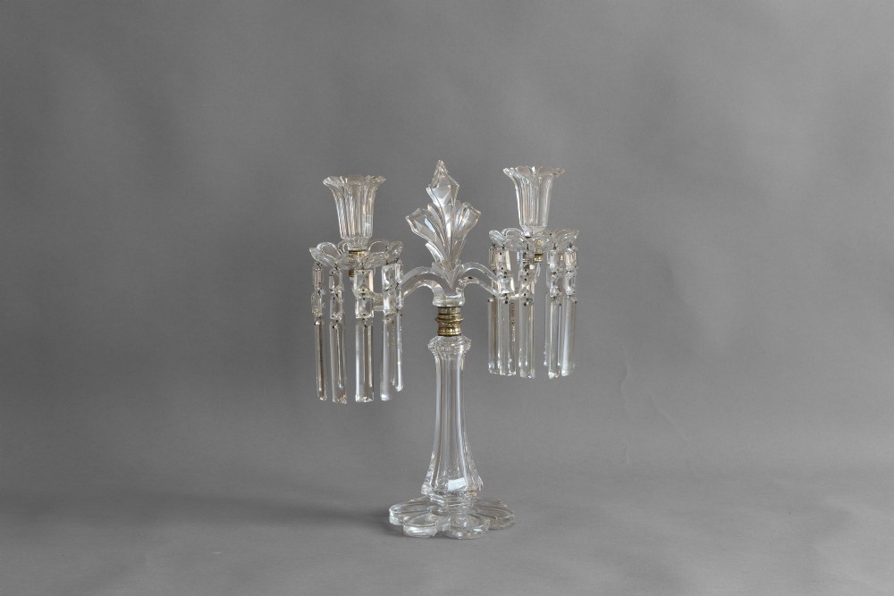 A pair of clear cut glass two-arm candelabras featuring hanging prism drops, fluted stems, and scalloped bases. View III