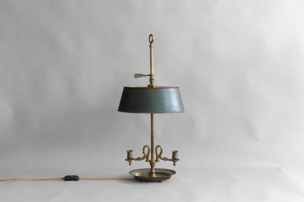 An antique French bouillotte lamp featuring a dark green metal tole shade, twin brass candle sconces, a central adjustment rod with a ring top, and a pierced dish base. View II
