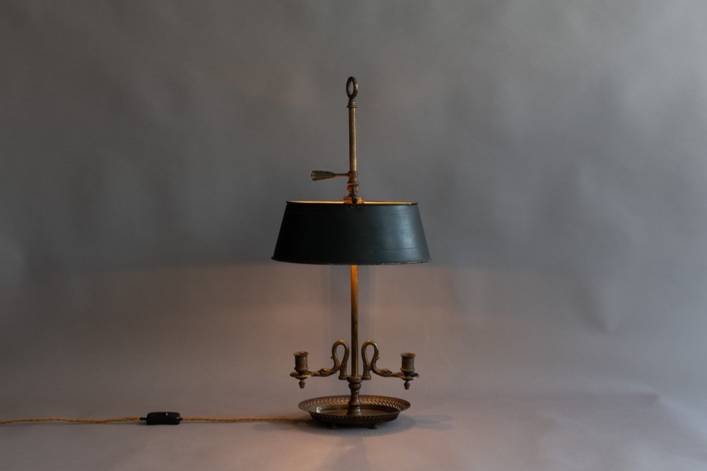 An antique French bouillotte lamp featuring a dark green metal tole shade, twin brass candle sconces, a central adjustment rod with a ring top, and a pierced dish base. View III