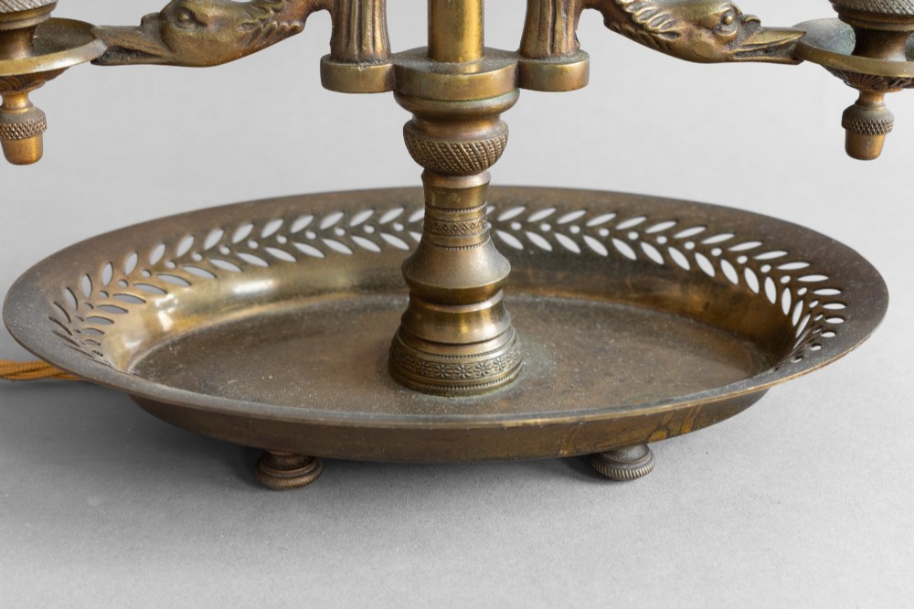 An antique French bouillotte lamp featuring a dark green metal tole shade, twin brass candle sconces, a central adjustment rod with a ring top, and a pierced dish base. View XI