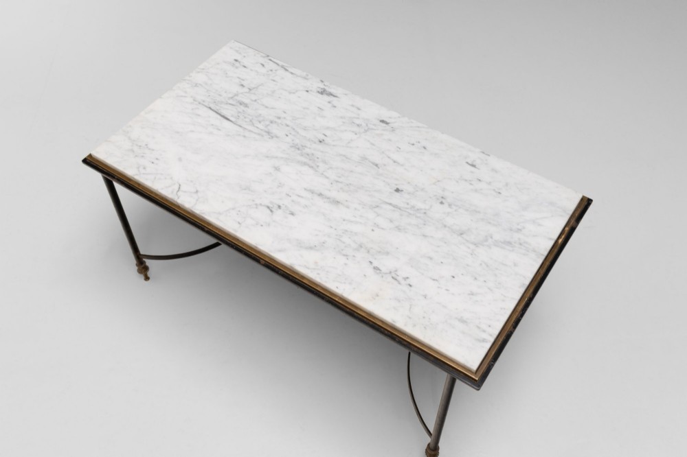 A rectangular coffee table featuring a polished white marble top set upon a black wrought iron frame with curved stretchers and brass finial feet. View IV