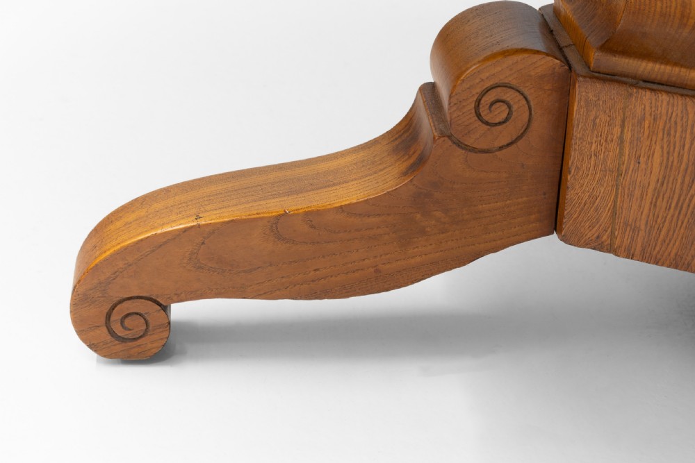 A Victorian tilt-top centre table in golden burr walnut veneer featuring a central starburst inlay and carved tripod pedestal base. View VII