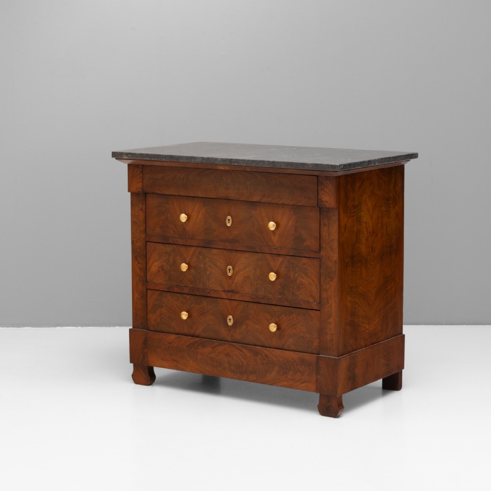 An antique 19th-century French flame walnut commode fitted with a dark grey marble slab top and brass drawer pulls. View II