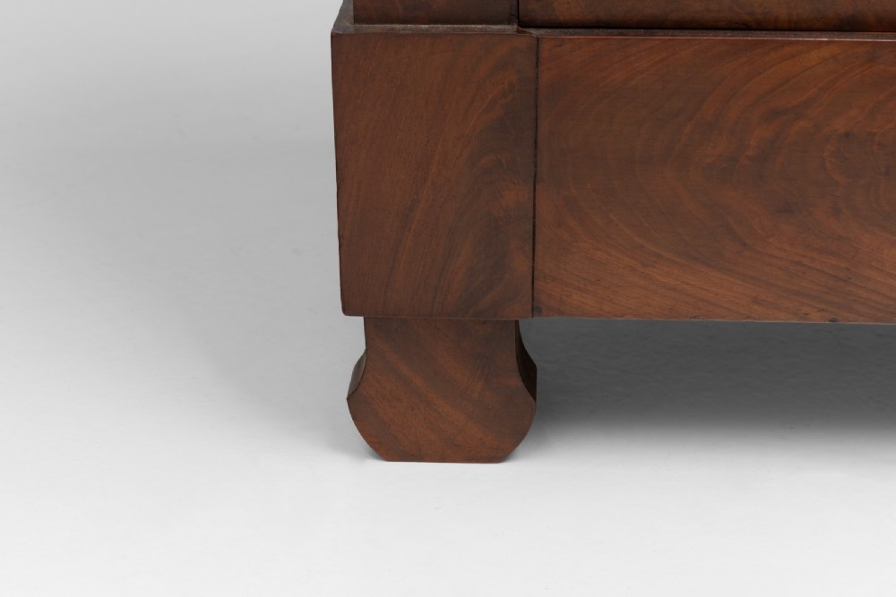 An antique 19th-century French flame walnut commode fitted with a dark grey marble slab top and brass drawer pulls. View VIII