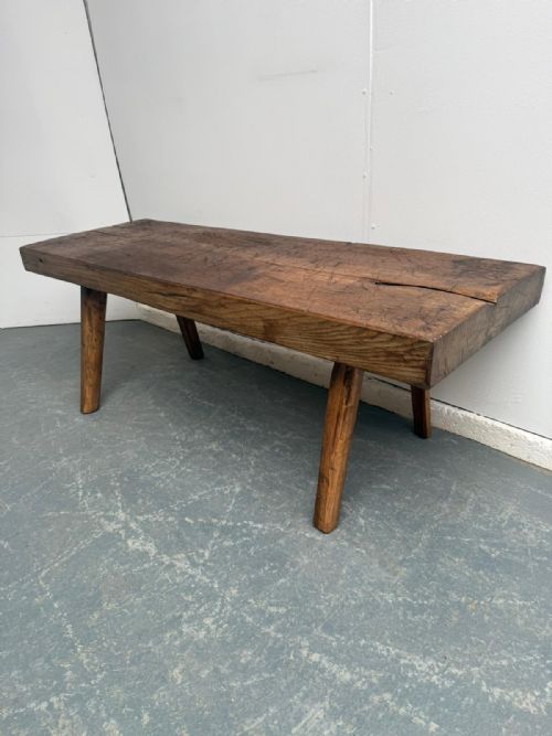 A NARROW HUNGARIAN ANTIQUE OAKHARDWOOD PIG BENCH 140CM