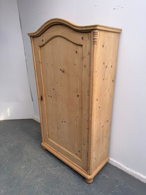 A CLEAN SHALLOW ARCHED ANTIQUE OLD PINE VICTORIAN CUPBOARD TO WAXPAINT
