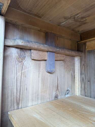 fig 1. A large Victorian stripped pine double-door knockdown wardrobe with raised rectangular door panels and a moulded top cornice.