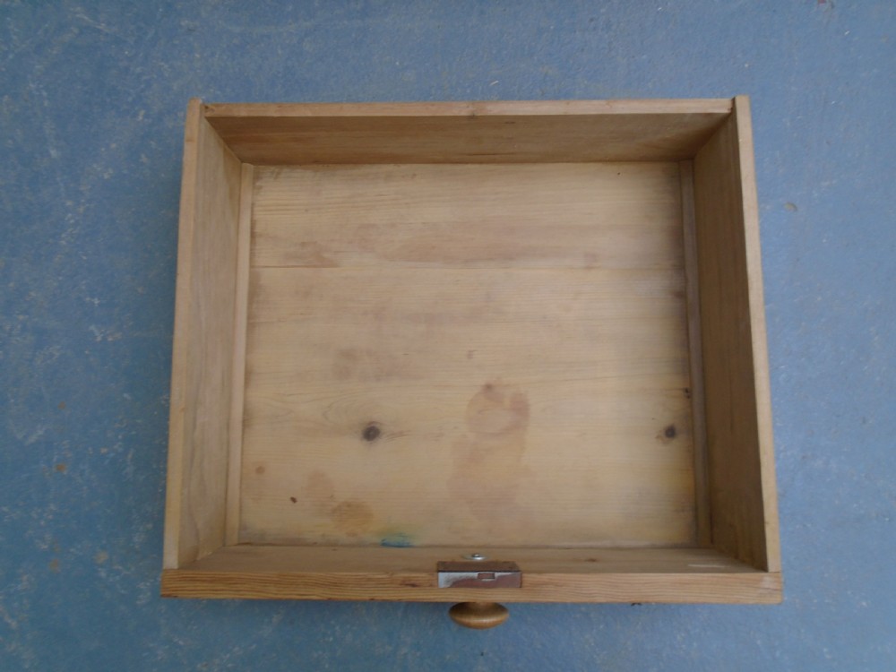 A Victorian waxed pine chest featuring two short over three long graduating drawers with turned wooden knobs. View XI