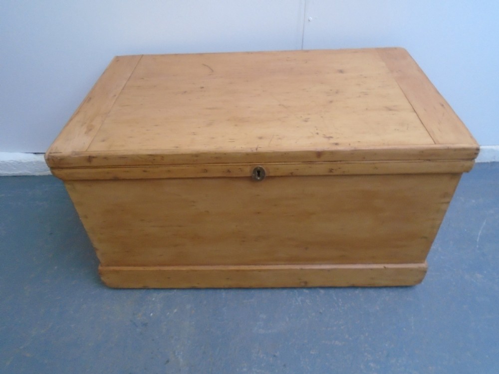 A rectangular Victorian waxed pine blanket box with side iron handles and a plinth base. View III