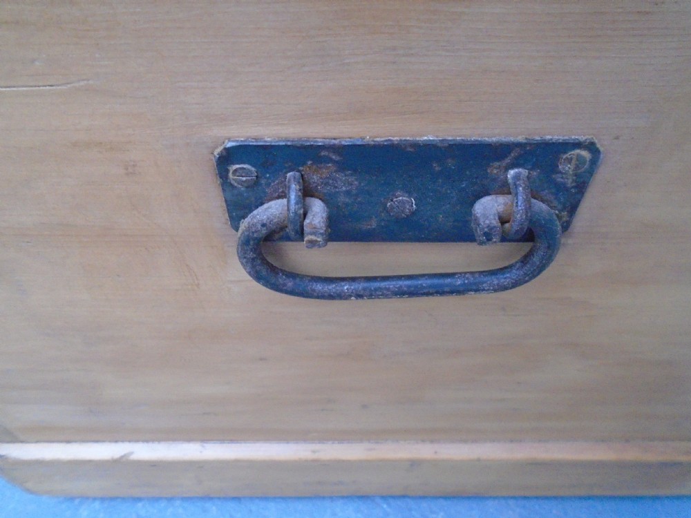 A rectangular Victorian waxed pine blanket box with side iron handles and a plinth base. View VI