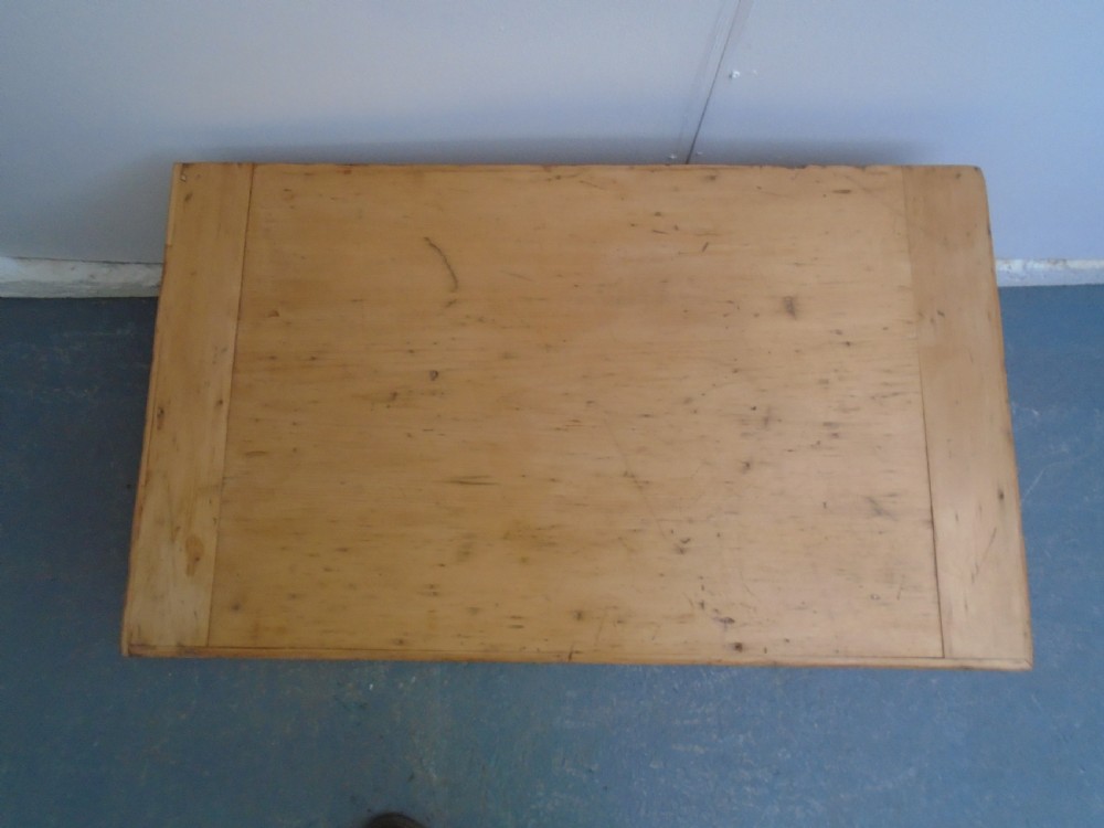 A rectangular Victorian waxed pine blanket box with side iron handles and a plinth base. View IX