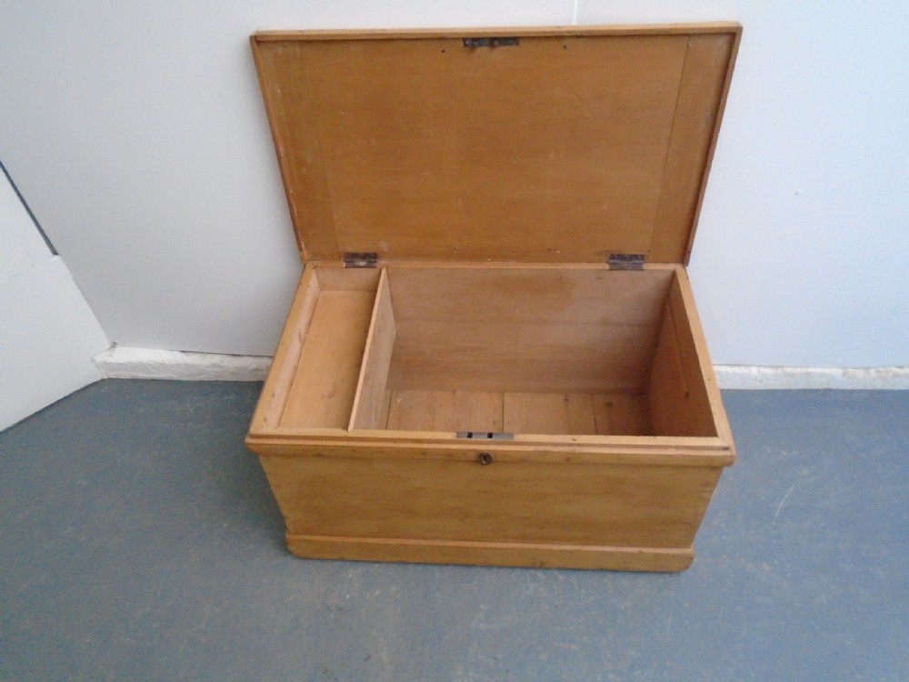 A rectangular Victorian waxed pine blanket box with side iron handles and a plinth base. View X