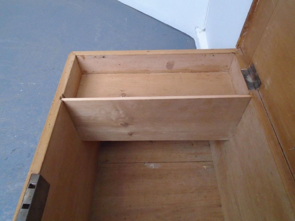 A rectangular Victorian waxed pine blanket box with side iron handles and a plinth base. View XI