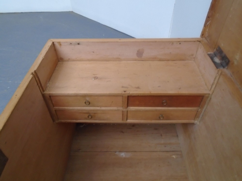 A rectangular Victorian waxed pine blanket box with side iron handles and a plinth base. View XII