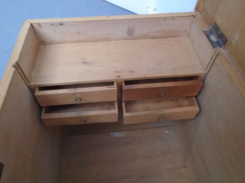 A rectangular Victorian waxed pine blanket box with side iron handles and a plinth base. View XIII