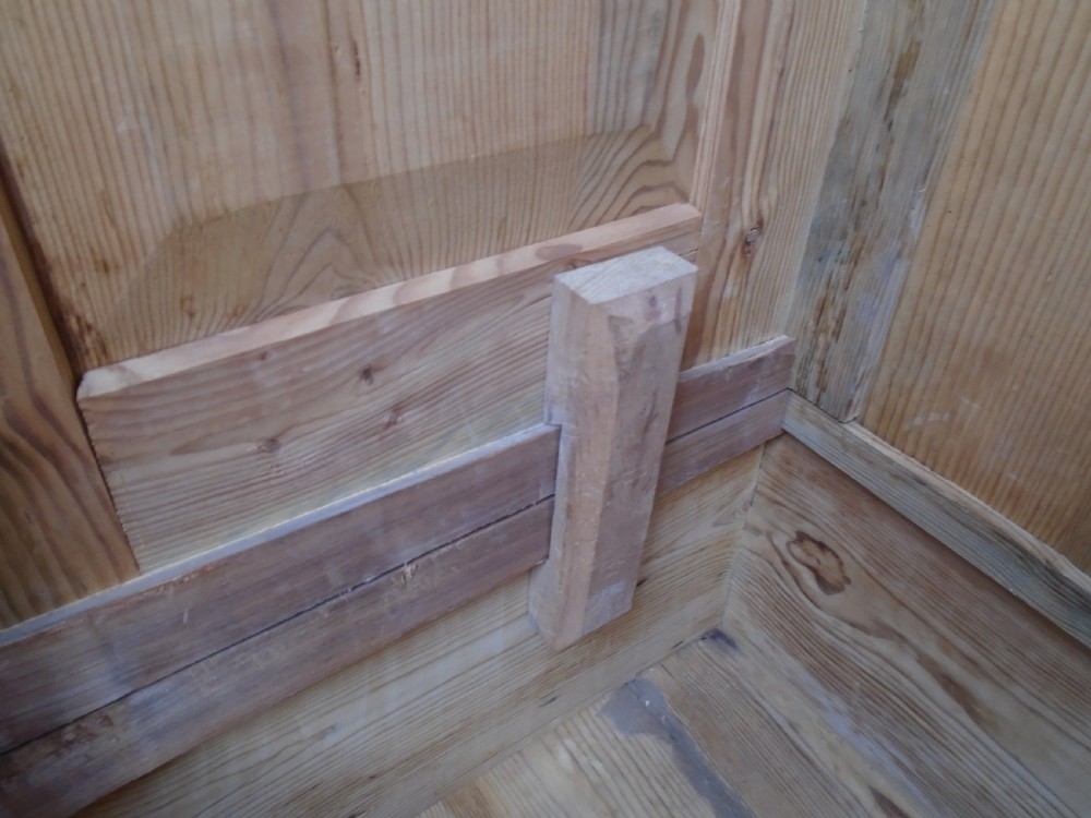 An unpainted Georgian pine two-door wardrobe featuring recessed panel doors, side panel construction, and a prominent moulded upper cornice. View XI