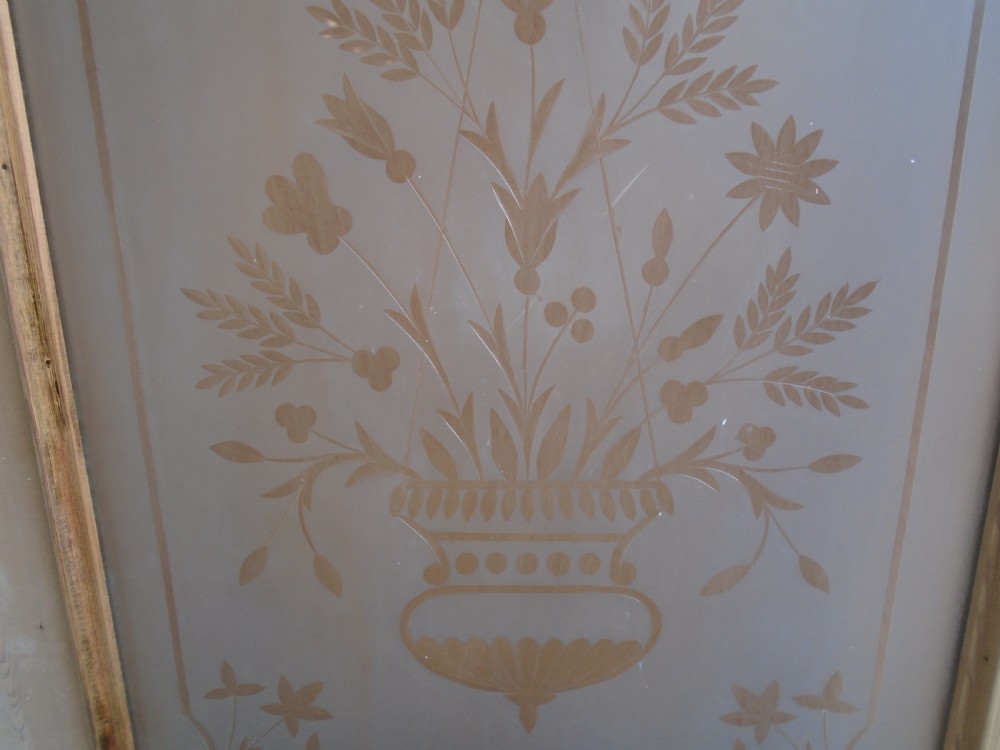 A Victorian stripped pine interior door featuring a large top panel of frosted glass etched with a central urn floral motif above two raised timber panels. View VII