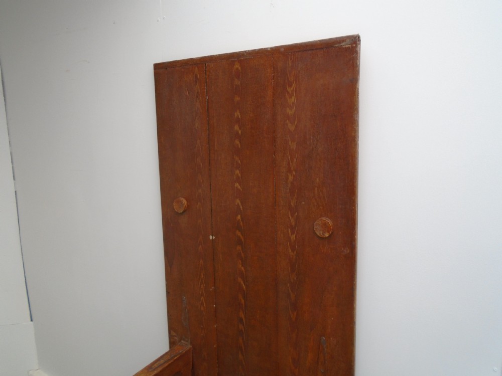 A Georgian pine chair-table featuring an armchair base with an under-seat drawer and an upright hinged timber backrest. View II