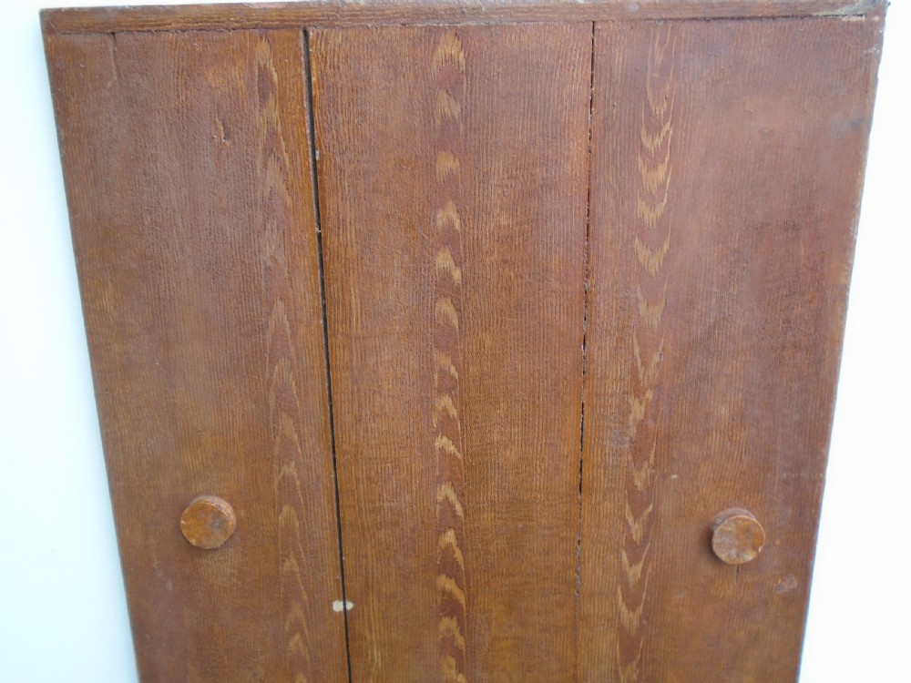 A Georgian pine chair-table featuring an armchair base with an under-seat drawer and an upright hinged timber backrest. View IV