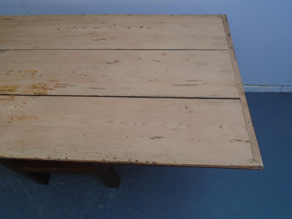 A Georgian pine chair-table featuring an armchair base with an under-seat drawer and an upright hinged timber backrest. View X