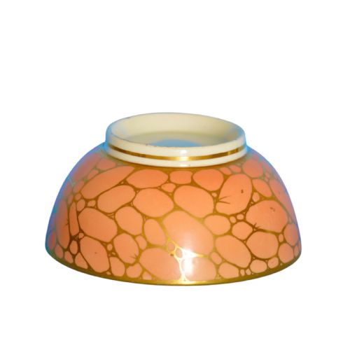 fig 2. A Regency period Coalport porcelain waste bowl featuring a salmon pink ground with a gilded network pattern and gold rim.