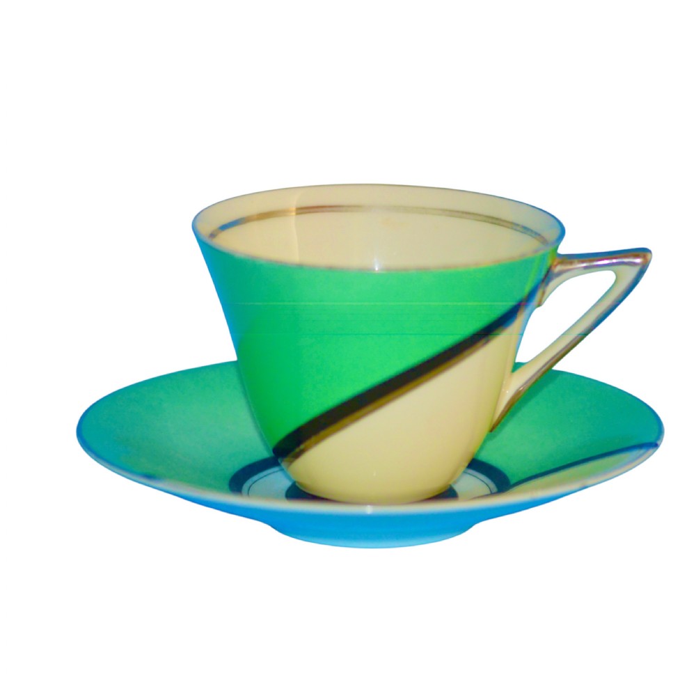 An Art Deco ceramic teacup, circular saucer, and square side plate featuring green and cream geometric panel decoration. View II