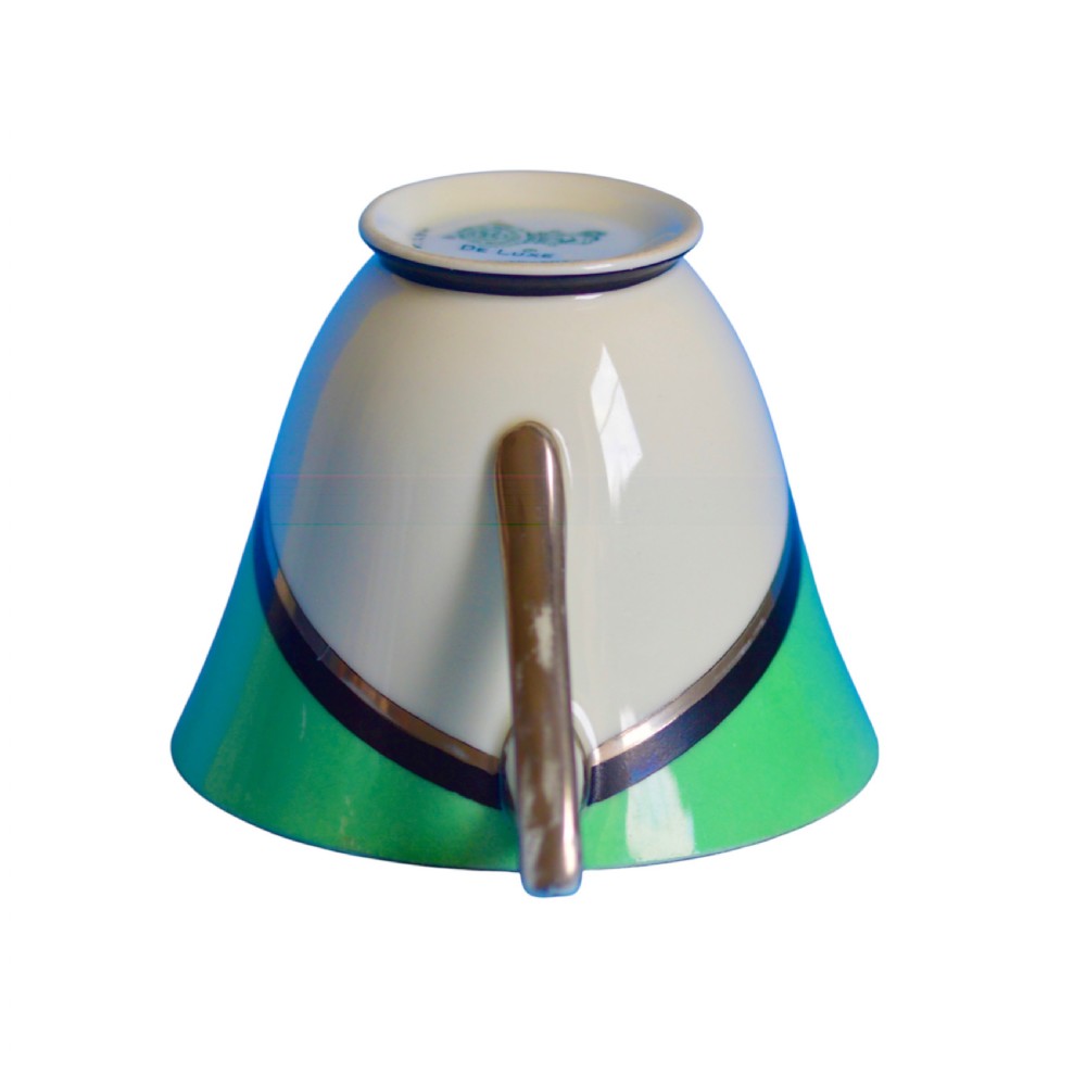 An Art Deco ceramic teacup, circular saucer, and square side plate featuring green and cream geometric panel decoration. View VII