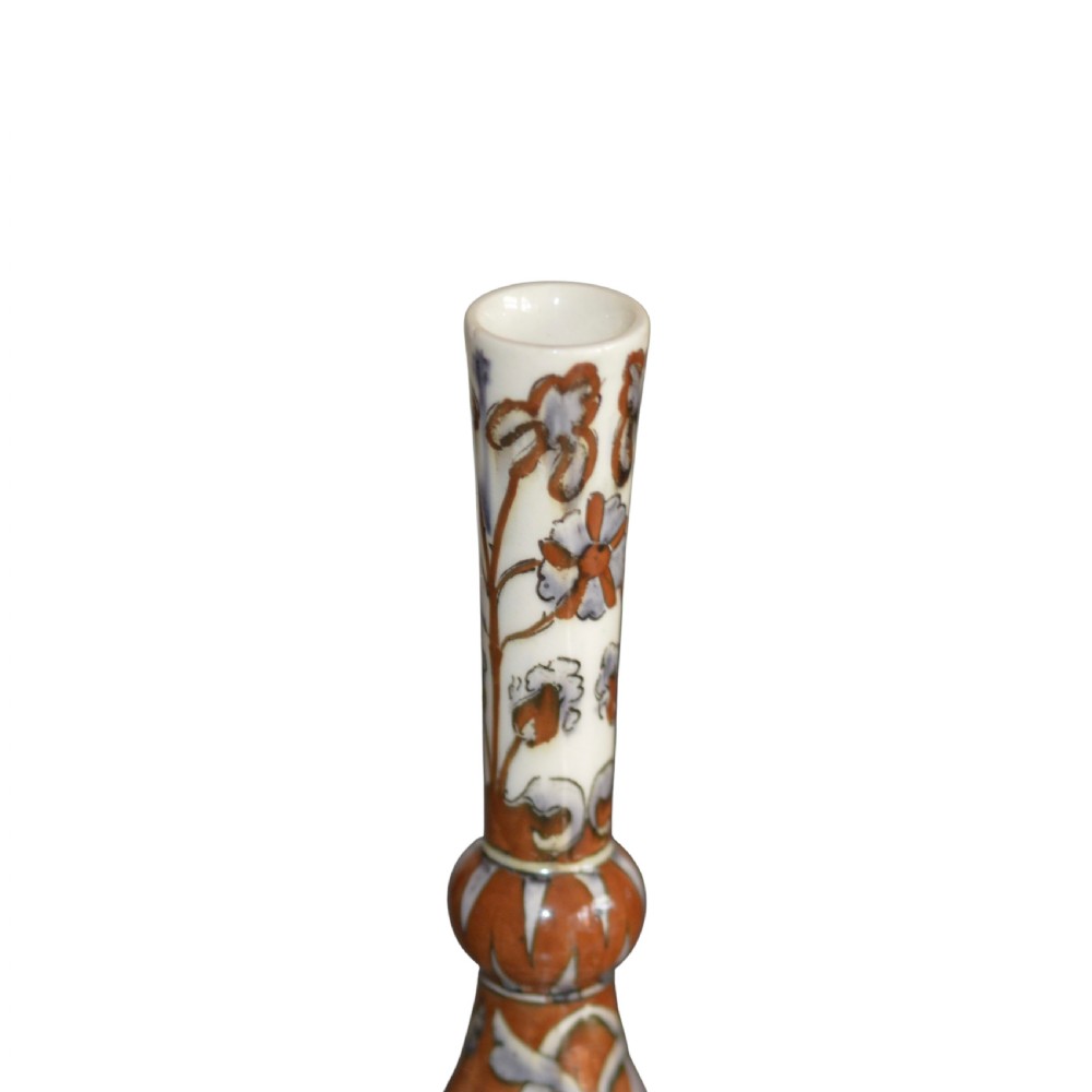 An antique Art Nouveau earthenware vase with a bulbous body, a narrow neck with a central knop, and hand-painted terracotta and grey foliage motifs. View II
