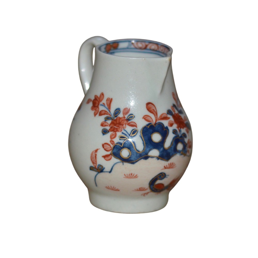 An 18th-century Lowestoft soft-paste porcelain sparrow-beak jug featuring hand-painted red and blue foliage and bird motifs. View II