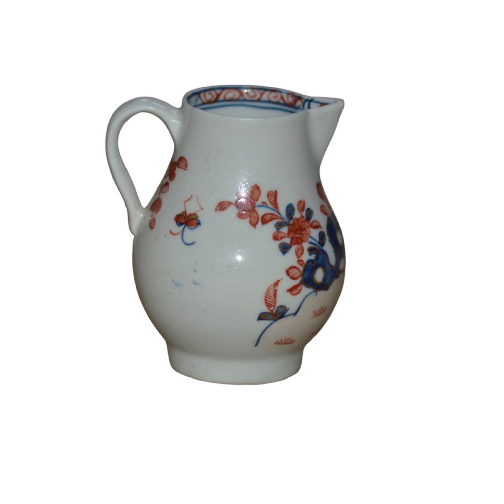 An 18th-century Lowestoft soft-paste porcelain sparrow-beak jug featuring hand-painted red and blue foliage and bird motifs. View III