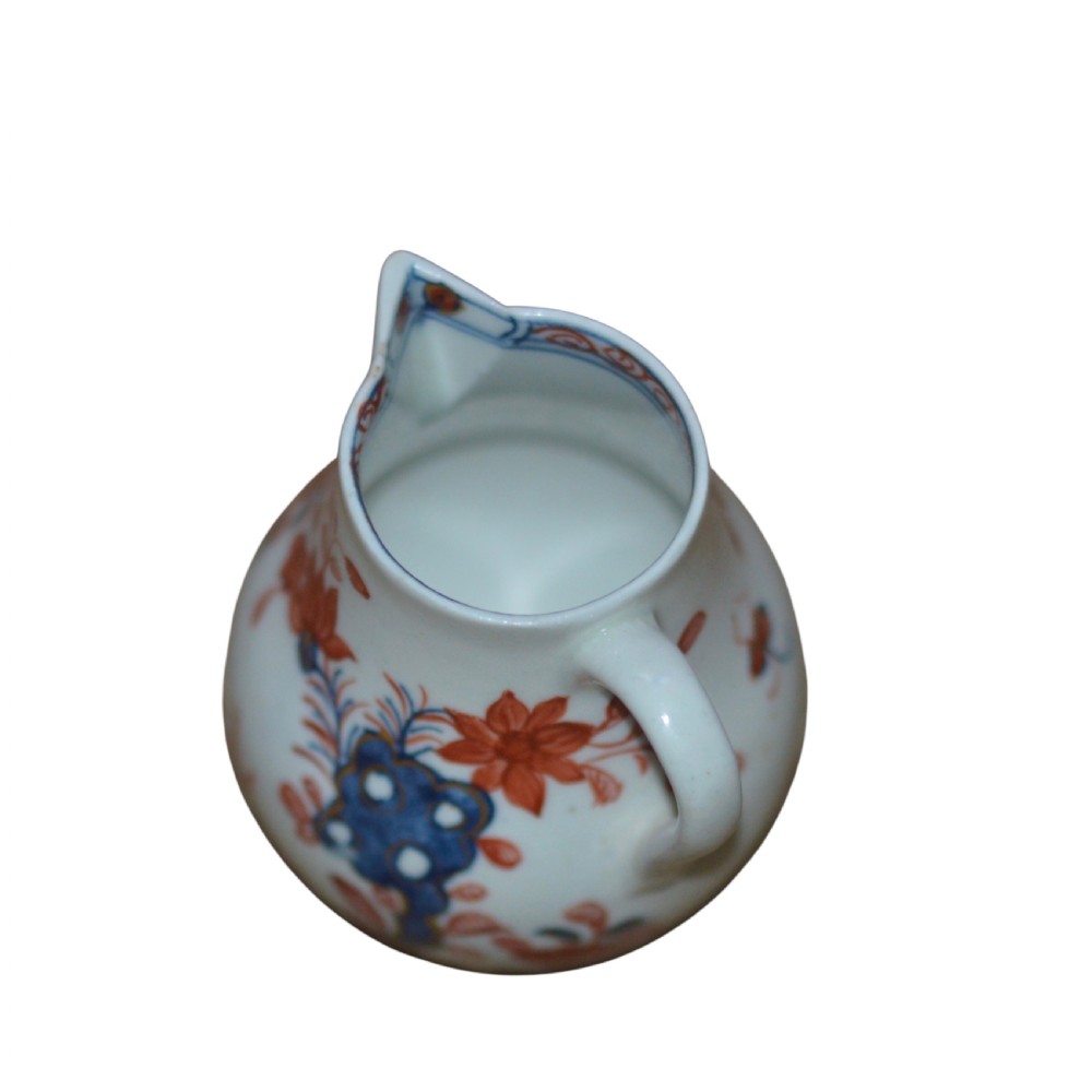 An 18th-century Lowestoft soft-paste porcelain sparrow-beak jug featuring hand-painted red and blue foliage and bird motifs. View VI